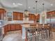 Spacious kitchen featuring granite countertops, stainless steel appliances, and wooden cabinets at 30909 N 27Th Ave, Phoenix, AZ 85085