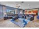Open living room with stylish rug, ceiling fan and access to dining and kitchen at 30909 N 27Th Ave, Phoenix, AZ 85085