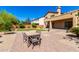 A spacious backyard with a dining table on brick pavers is great for entertaining at 31604 N 19Th Ave, Phoenix, AZ 85085