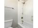 Bathroom with white tile, chrome fixtures, and walk-in shower at 31604 N 19Th Ave, Phoenix, AZ 85085