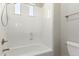 Bright bathroom with a shower-tub combo, white tile, and chrome fixtures at 31604 N 19Th Ave, Phoenix, AZ 85085