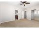 Bedroom featuring carpet, closet, bathroom and ceiling fan at 31604 N 19Th Ave, Phoenix, AZ 85085