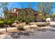 Two-story home featuring a three-car garage, stone accents, and a beautiful desert landscaped front yard at 31604 N 19Th Ave, Phoenix, AZ 85085