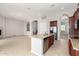 Kitchen island with sink and open floorplan into living room, ideal for entertaining at 31604 N 19Th Ave, Phoenix, AZ 85085