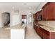 Updated kitchen with granite counters, stainless appliances, including refrigerator and double oven at 31604 N 19Th Ave, Phoenix, AZ 85085