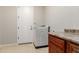 Laundry room featuring tile flooring, washer, and countertop space at 31604 N 19Th Ave, Phoenix, AZ 85085