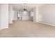 Spacious living room featuring neutral paint, plush carpeting, and a ceiling fan at 31604 N 19Th Ave, Phoenix, AZ 85085