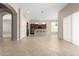 Open concept living and kitchen area with tile flooring and stainless steel appliances at 31604 N 19Th Ave, Phoenix, AZ 85085