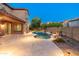 Outdoor living space with a covered patio, stunning pool, and meticulously designed landscaping for relaxing moments at 3603 E Salter Dr, Phoenix, AZ 85050