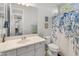 Bright bathroom with a single sink vanity and a shower/tub combo with a decorative curtain at 3603 E Salter Dr, Phoenix, AZ 85050