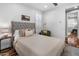 Inviting bedroom showcasing hardwood floors, a ceiling fan, and a queen bed at 3603 E Salter Dr, Phoenix, AZ 85050