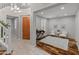 Welcoming foyer boasts a curved staircase, wood floors, and ample natural light streaming through plantation shutters at 3603 E Salter Dr, Phoenix, AZ 85050