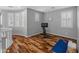 Exercise room with hardwood flooring, exercise bike, yoga mat and bright natural light at 3603 E Salter Dr, Phoenix, AZ 85050
