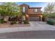 Beautiful two-story home with a well-maintained lawn, mature trees, and a spacious driveway leading to a garage at 3603 E Salter Dr, Phoenix, AZ 85050