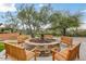 Cozy outdoor fire pit with comfortable seating, ideal for gathering and enjoying cool evenings at 3603 E Salter Dr, Phoenix, AZ 85050