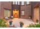 Charming front patio featuring a cozy seating area, potted flowers, and a welcoming entrance at 3603 E Salter Dr, Phoenix, AZ 85050