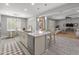 Open concept kitchen with a large island, stainless steel appliances, and adjacent living space at 3603 E Salter Dr, Phoenix, AZ 85050
