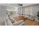 Bright and airy living room with an open floor plan, seamlessly connecting to the kitchen and backyard at 3603 E Salter Dr, Phoenix, AZ 85050