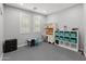Spacious playroom with neutral tones and built-in storage solutions at 3603 E Salter Dr, Phoenix, AZ 85050