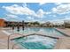 Resort-style community pool featuring lounge chairs, covered cabanas, and luxurious jacuzzi at 3603 E Salter Dr, Phoenix, AZ 85050