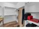 Bright walk-in closet offers ample storage with shelves and rods, providing an organized space for clothing and accessories at 3603 E Salter Dr, Phoenix, AZ 85050