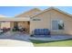 Backyard featuring a seating area, turf, stone pavers, and access to the home at 3612 W Charlotte Dr, Glendale, AZ 85310