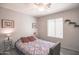 Cozy bedroom with a ceiling fan, wood-look flooring, and warm, inviting decor at 3612 W Charlotte Dr, Glendale, AZ 85310
