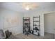 Stylish bedroom with a comfortable couch, a modern ceiling fan, and a dedicated workspace for enhanced productivity at 3612 W Charlotte Dr, Glendale, AZ 85310