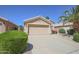 Charming single-story home showcasing a well-maintained lawn, complemented by a two car garage and beautiful desert landscaping at 3612 W Charlotte Dr, Glendale, AZ 85310