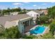 Aerial view of a home with a private in-ground pool and covered patio at 3671 S Greythorne Way, Chandler, AZ 85248