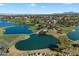A beautiful aerial view of a golf course with water features on a sunny day at 3671 S Greythorne Way, Chandler, AZ 85248