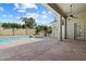 Covered patio overlooks a private pool and desert landscaped backyard with block fence at 3671 S Greythorne Way, Chandler, AZ 85248