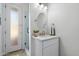 Bathroom features a white vanity with an oval mirror and a tiled glass door shower at 3671 S Greythorne Way, Chandler, AZ 85248