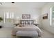 Bright bedroom featuring a decorative bench, neutral colors, and shuttered windows at 3671 S Greythorne Way, Chandler, AZ 85248