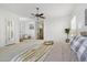 Airy bedroom featuring neutral colors, a ceiling fan, and shuttered windows at 3671 S Greythorne Way, Chandler, AZ 85248