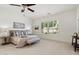 Well-lit bedroom featuring a comfortable bed, shuttered windows, and neutral tones at 3671 S Greythorne Way, Chandler, AZ 85248