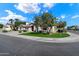 Charming curb appeal with lush landscaping, mature trees, and a well-manicured lawn at 3671 S Greythorne Way, Chandler, AZ 85248