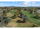Scenic view of a lush golf course with mature trees and rolling fairways at 3671 S Greythorne Way, Chandler, AZ 85248