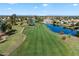 Picturesque golf course view with a scenic lake and lush greenery at 3671 S Greythorne Way, Chandler, AZ 85248