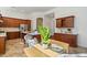 Bright and airy eat-in kitchen featuring stainless steel appliances, stone floors, and views to a dining area at 3671 S Greythorne Way, Chandler, AZ 85248