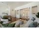 Open-concept living room with hardwood floors leading to the front entry door at 3671 S Greythorne Way, Chandler, AZ 85248