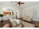 Living room featuring hardwood floors, white walls, and view to the kitchen at 3671 S Greythorne Way, Chandler, AZ 85248