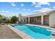 An inviting private pool is set amidst a well maintained backyard, perfect for relaxing or entertaining at 3671 S Greythorne Way, Chandler, AZ 85248