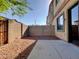 Low-maintenance backyard with gravel, a concrete patio, and block wall fencing at 3820 E Mcdowell Rd # 102, Phoenix, AZ 85008