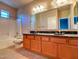 Bathroom featuring double sinks with granite countertops and a shower-tub combo at 3820 E Mcdowell Rd # 102, Phoenix, AZ 85008