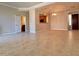 Spacious living area featuring neutral tile flooring and decorative tray ceiling at 3820 E Mcdowell Rd # 102, Phoenix, AZ 85008