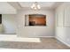 Open living space with tile floors, showcasing the kitchen through an arched pass-through at 3820 E Mcdowell Rd # 102, Phoenix, AZ 85008