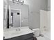 Functional bathroom with a combined shower and bathtub, toilet, and vanity with a neutral color scheme at 3898 E San Remo Ave, Gilbert, AZ 85234