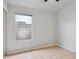 Neutral-toned bedroom featuring tile flooring, window with a blind, and a spacious closet at 3898 E San Remo Ave, Gilbert, AZ 85234
