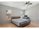 Comfortable bedroom with natural light and a ceiling fan at 3898 E San Remo Ave, Gilbert, AZ 85234